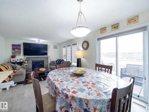 3444 Weidle Way, Edmonton, AB - Indoor Photo Showing Dining Room With Fireplace
