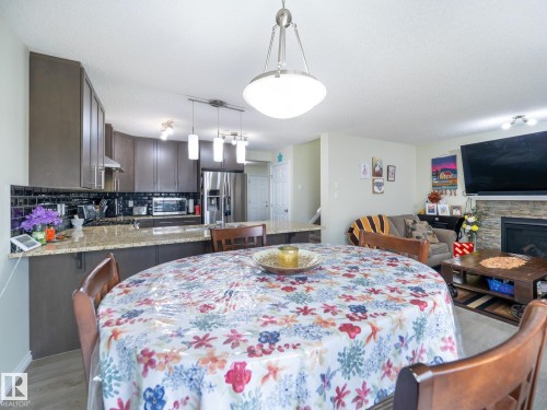 3444 Weidle Way, Edmonton, AB - Indoor Photo Showing Dining Room With Fireplace