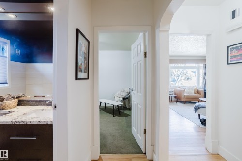 This property features well-maintained interiors with light-colored walls and hardwood flooring, creating a bright and inviting atmosphere - 10643 66 Avenue, Edmonton, AB - Indoor Photo Showing Other Room