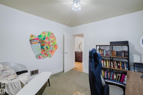 The room features light-colored walls and a neutral-toned carpet - 10643 66 Avenue, Edmonton, AB - Indoor