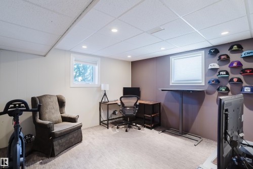 This versatile room features neutral-toned walls, recessed lighting, and a window providing natural light - 10643 66 Avenue, Edmonton, AB - Indoor