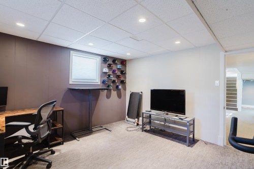 Finished room featuring recessed lighting, a drop ceiling, and carpeted flooring - 10643 66 Avenue, Edmonton, AB - Indoor