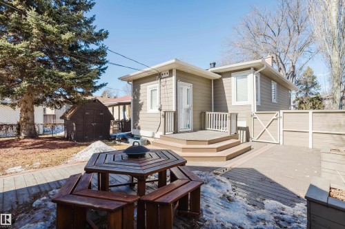 The property features a private backyard with a wooden deck and a shed - 10643 66 Avenue, Edmonton, AB - Outdoor With Deck Patio Veranda