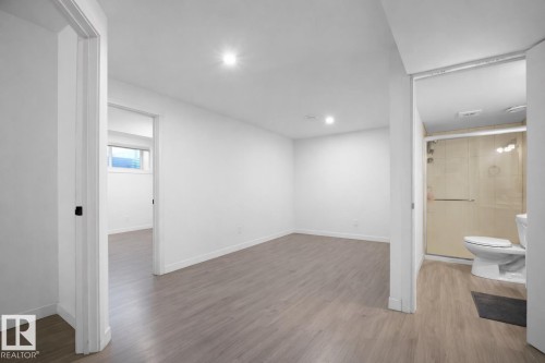 Spacious interior room with light wood-style flooring and recessed lighting - 4405 Crabapple Landing Landing, Edmonton, AB - Indoor Photo Showing Other Room