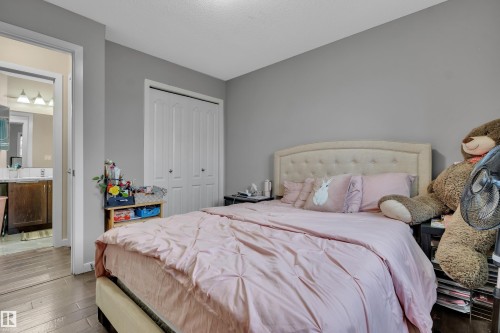 This room features light grey walls and hardwood flooring - 320 392 Silver Berry Road, Edmonton, AB - Indoor Photo Showing Bedroom