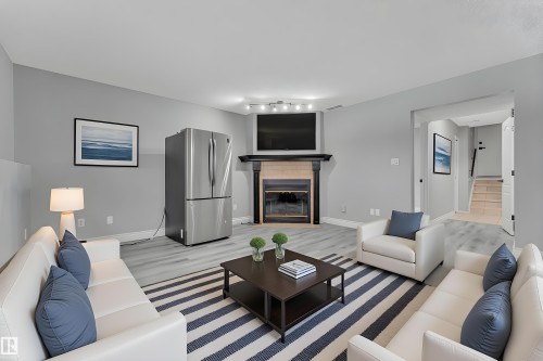 3623 24 Avenue, Edmonton, AB - Indoor Photo Showing Living Room With Fireplace