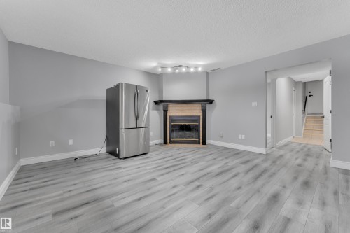3623 24 Avenue, Edmonton, AB - Indoor Photo Showing Living Room With Fireplace