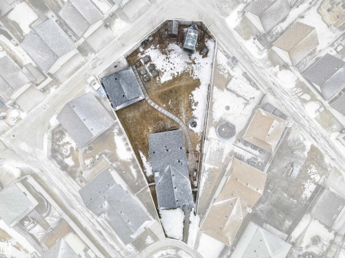 Aerial view showcasing the property's distinct lot shape, two visible structures, and a curved pathway - 1665 Tompkins Place, Edmonton, AB - Other