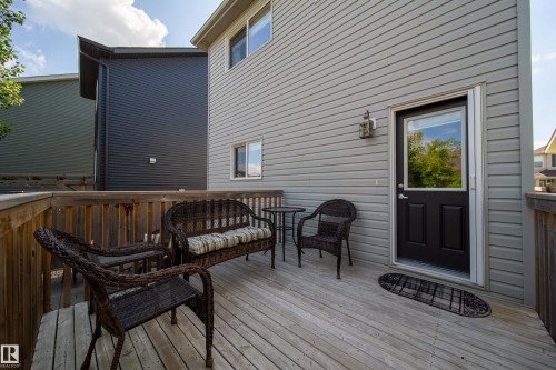 The property features a wooden deck with a wooden railing - 3451 Cutler Crescent, Edmonton, AB - Outdoor With Deck Patio Veranda With Exterior