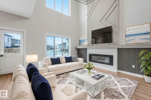 8 Dalquist Bay, Leduc, AB - Indoor Photo Showing Living Room With Fireplace