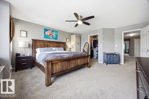 Spacious room featuring light-colored carpeting, a ceiling fan, and light gray walls - 13024 206 Street, Edmonton, AB - Indoor Photo Showing Bedroom