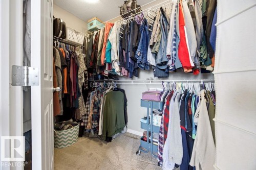 The closet features wire shelving and hanging rods - 13024 206 Street, Edmonton, AB - Indoor With Storage