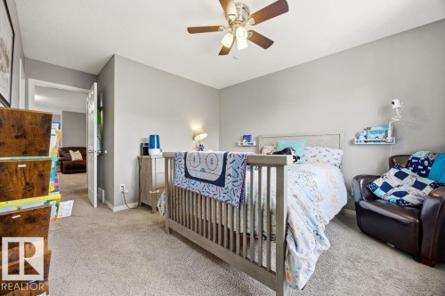This room features carpeted flooring and neutral colored walls - 13024 206 Street, Edmonton, AB - Indoor Photo Showing Bedroom