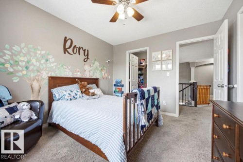 This room features a ceiling fan with integrated lighting and carpeted flooring - 13024 206 Street, Edmonton, AB - Indoor Photo Showing Bedroom