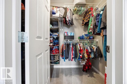 This closet features wire shelving and hanging rods, providing organized storage solutions - 13024 206 Street, Edmonton, AB - Indoor With Storage