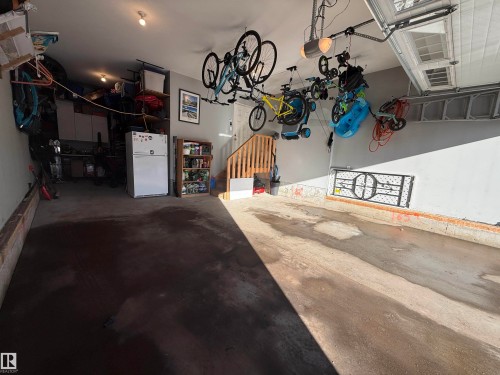 The property features an attached garage with a concrete floor and painted walls - 13024 206 Street, Edmonton, AB - Indoor Photo Showing Other Room