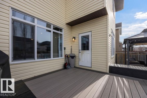 The property features a spacious deck with composite decking, providing an outdoor living area - 13024 206 Street, Edmonton, AB - Outdoor With Deck Patio Veranda With Exterior