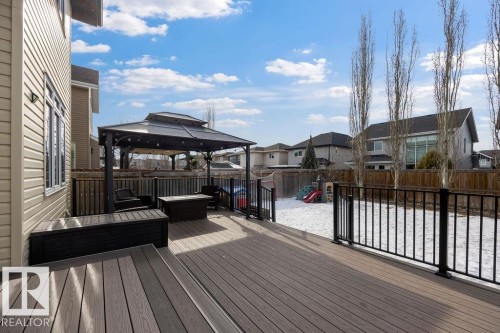 The property features a spacious deck with composite decking, a gazebo, and a railing overlooking the yard - 13024 206 Street, Edmonton, AB - Outdoor With Deck Patio Veranda With Exterior