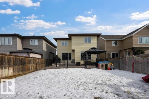 The property features a rear deck with a gazebo, offering an outdoor living space - 13024 206 Street, Edmonton, AB - Outdoor