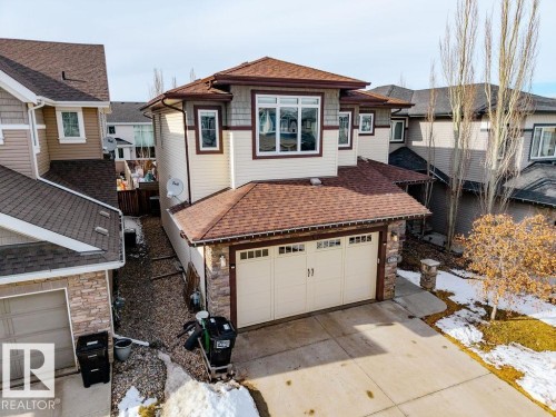The property features a two-story design with a prominent front-facing garage - 13024 206 Street, Edmonton, AB - Outdoor With Exterior