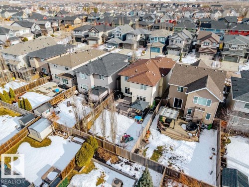 The property features a private backyard with a wooden fence, a deck, and an outdoor storage shed - 13024 206 Street, Edmonton, AB - Outdoor