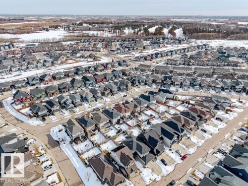 Aerial view showcasing the residential neighbourhood with a variety of property styles and surrounding natural areas - 13024 206 Street, Edmonton, AB - Outdoor With View