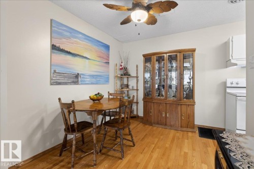 The interior features light-colored walls and hardwood flooring - 2 Mcleod Place, Edmonton, AB - Indoor Photo Showing Dining Room