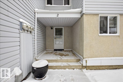 The property features a private entrance with a covered porch and exterior siding - 2 Mcleod Place, Edmonton, AB - Outdoor With Exterior