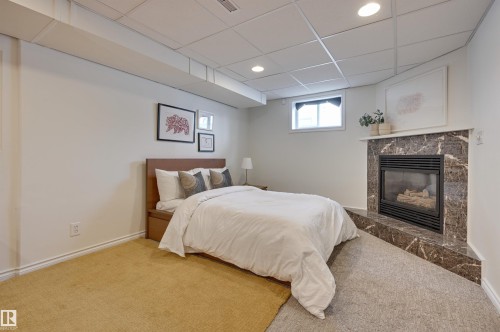 14015 104 Avenue, Edmonton, AB - Indoor Photo Showing Bedroom With Fireplace