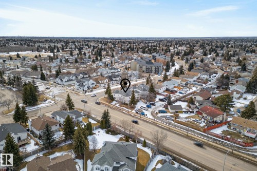 Aerial view of a residential neighborhood with a mix of detached properties and apartment buildings - 2006 Mill Woods Road E, Edmonton, AB - Outdoor With View