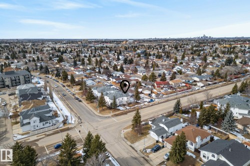 Aerial view showcasing the property's location within a residential neighborhood featuring established trees - 2006 Mill Woods Road E, Edmonton, AB - Outdoor With View