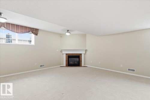 4 102 Bridgeport Crossing, Leduc, AB - Indoor With Fireplace