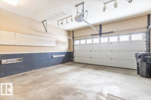 4 102 Bridgeport Crossing, Leduc, AB - Indoor Photo Showing Garage