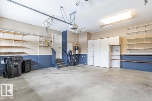 4 102 Bridgeport Crossing, Leduc, AB - Indoor Photo Showing Garage