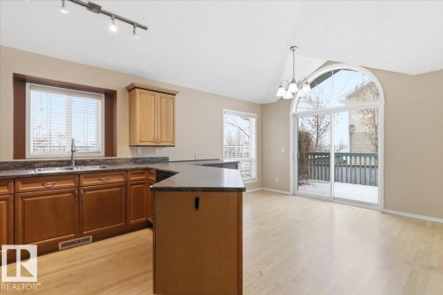 4 102 Bridgeport Crossing, Leduc, AB - Indoor Photo Showing Kitchen With Double Sink