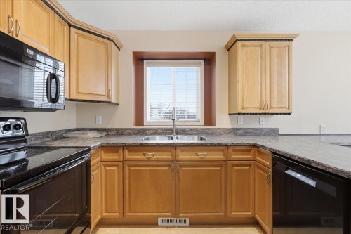 4 102 Bridgeport Crossing, Leduc, AB - Indoor Photo Showing Kitchen With Double Sink
