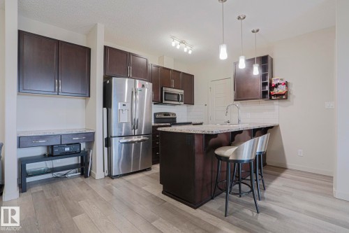 212 320 Ambleside Link, Edmonton, AB - Indoor Photo Showing Kitchen With Stainless Steel Kitchen With Upgraded Kitchen