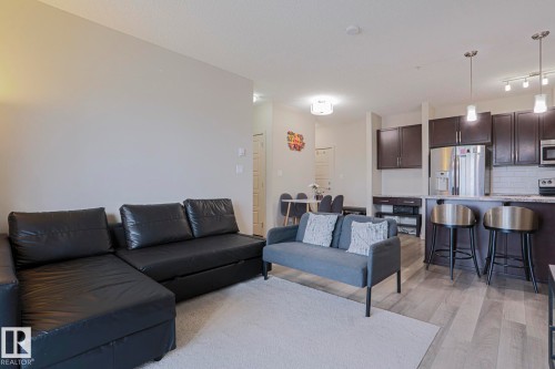 212 320 Ambleside Link, Edmonton, AB - Indoor Photo Showing Living Room