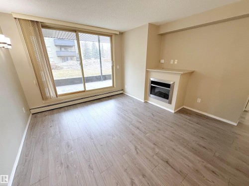 104 17003 67 Avenue, Edmonton, AB - Indoor Photo Showing Living Room With Fireplace