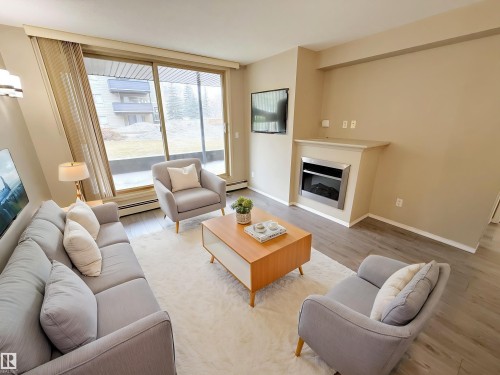 104 17003 67 Avenue, Edmonton, AB - Indoor Photo Showing Living Room With Fireplace