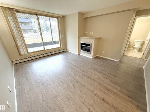 104 17003 67 Avenue, Edmonton, AB - Indoor Photo Showing Living Room With Fireplace