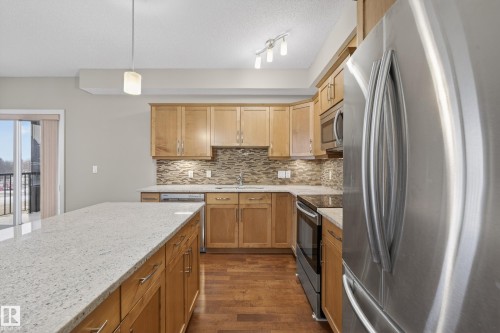 408 10530 56 Avenue, Edmonton, AB - Indoor Photo Showing Kitchen With Stainless Steel Kitchen With Upgraded Kitchen