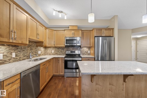 408 10530 56 Avenue, Edmonton, AB - Indoor Photo Showing Kitchen With Stainless Steel Kitchen With Double Sink With Upgraded Kitchen