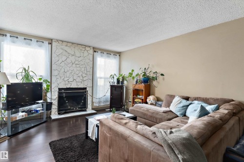 1128 Knottwood Road E, Edmonton, AB - Indoor Photo Showing Living Room With Fireplace