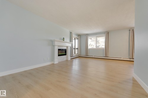 309 14811 51 Avenue, Edmonton, AB - Indoor Photo Showing Living Room With Fireplace