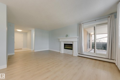 309 14811 51 Avenue, Edmonton, AB - Indoor Photo Showing Other Room With Fireplace