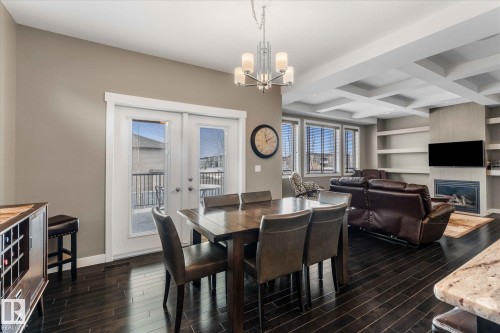 64 Hilldowns Drive, Spruce Grove, AB - Indoor Photo Showing Dining Room With Fireplace
