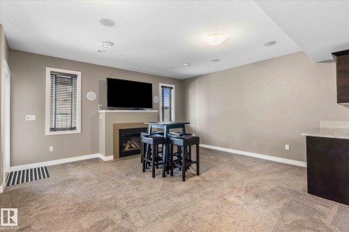 64 Hilldowns Drive, Spruce Grove, AB - Indoor Photo Showing Other Room With Fireplace