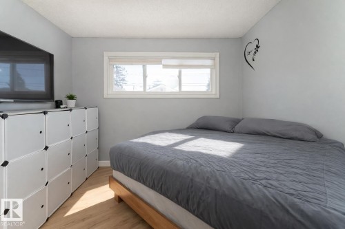 The property features light-colored walls and flooring, with a window providing natural light - 16131 109 Avenue, Edmonton, AB - Indoor Photo Showing Bedroom