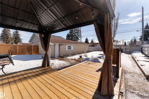 The property features a spacious wooden deck with a gazebo, providing an outdoor living area - 16131 109 Avenue, Edmonton, AB - Outdoor With Deck Patio Veranda With Exterior
